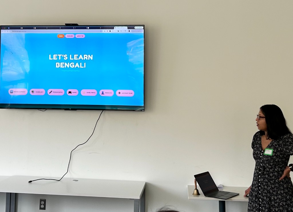 A member presenting a homemade "Let's Learn Bengali" web app with sections for the alphabet, vocabulary, pronunciation, and games.
