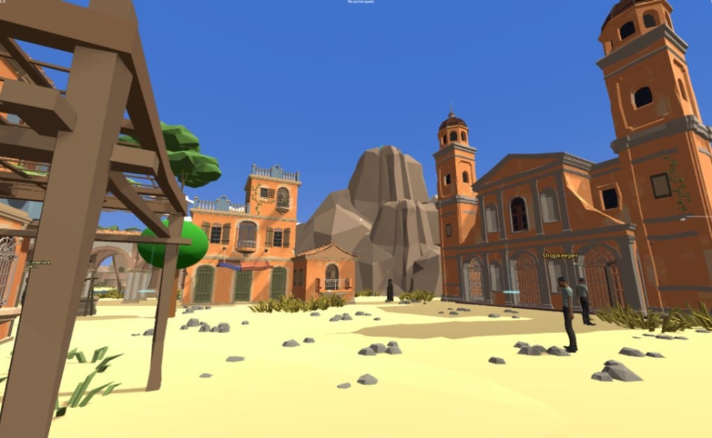 A low-poly 3D desert town with orange stucco buildings and a bell tower, from a game built by a club member and his son.